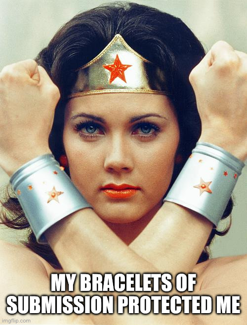 wonder woman | My bracelets of submission protected me | image tagged in wonder woman | made w/ Imgflip meme maker