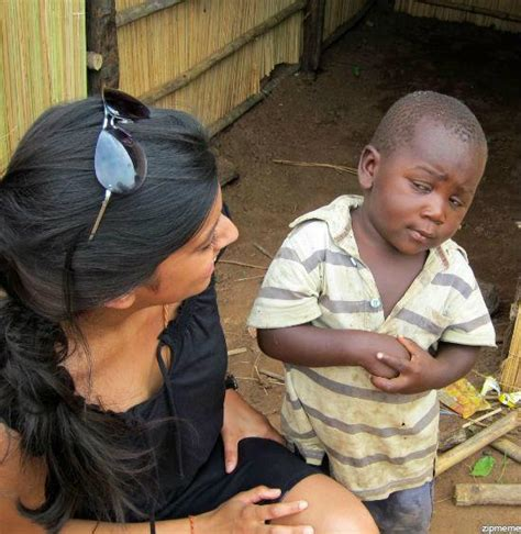 Incredulous little black kid looking up at white lady Blank Meme Template