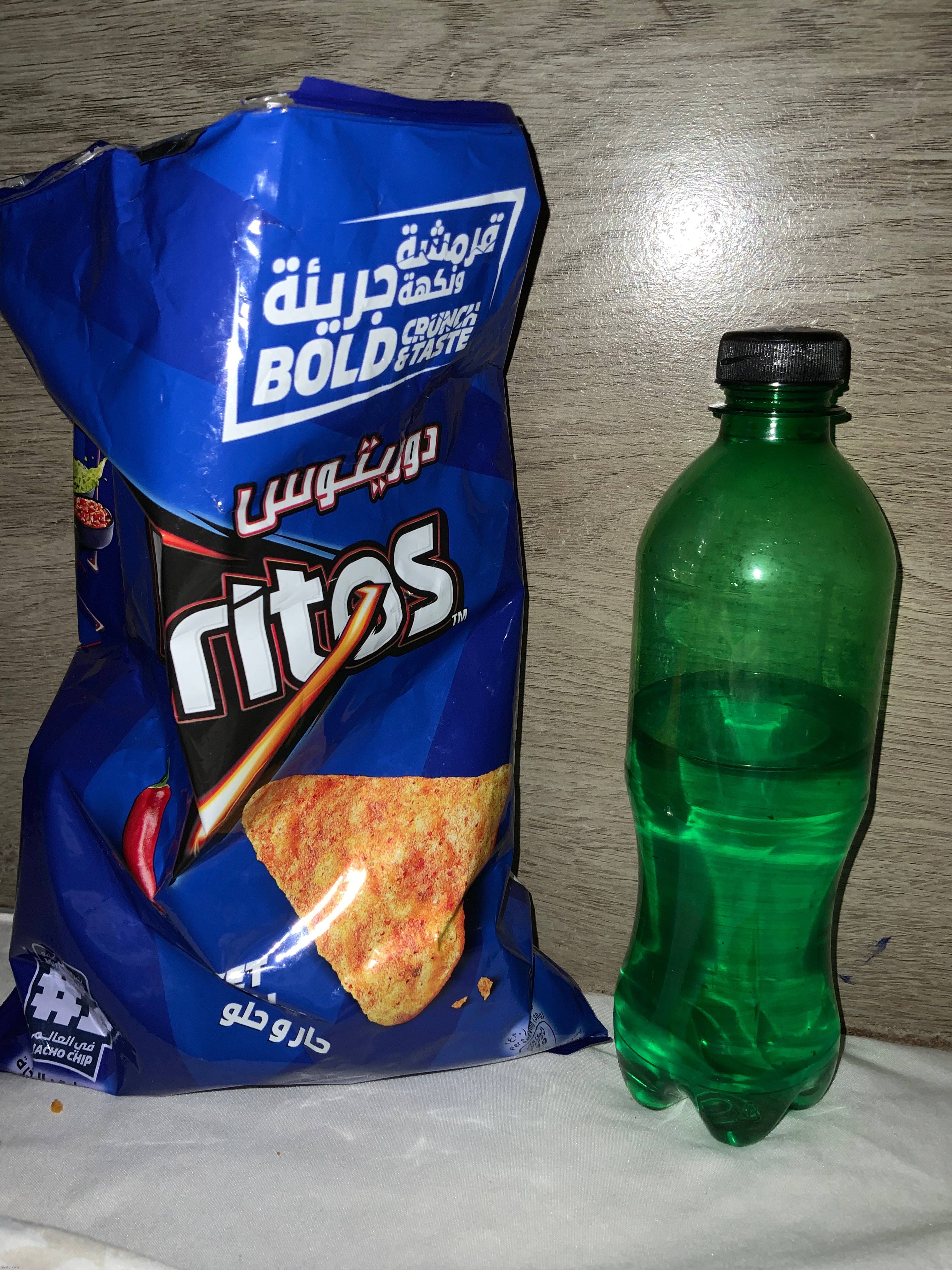 This is my lunch where I make Memes and watch YouTube videos (it has Arabic letters on my Doritos because I live in Middle East) | image tagged in lunch,mountain dew,doritos | made w/ Imgflip meme maker