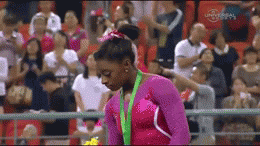 All-around gymnastics champion Simone Biles chased by bee on medal podium (Video)