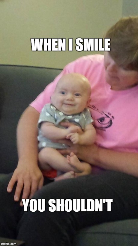 WHEN I SMILE YOU SHOULDN'T | image tagged in mischievous baby | made w/ Imgflip meme maker