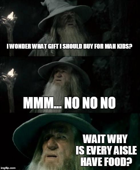 Confused Gandalf Meme | I WONDER WHAT GIFT I SHOULD BUY FOR MAH KIDS? MMM... NO NO NO WAIT WHY IS EVERY AISLE HAVE FOOD? | image tagged in memes,confused gandalf | made w/ Imgflip meme maker