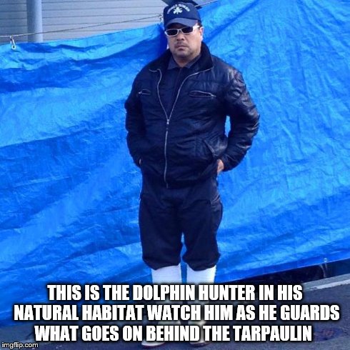 THIS IS THE DOLPHIN HUNTER IN HIS NATURAL HABITAT WATCH HIM AS HE GUARDS WHAT GOES ON BEHIND THE TARPAULIN | image tagged in dolphins taiji,dolphin hunter | made w/ Imgflip meme maker