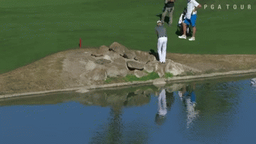 Zach Johnson's shot from rock pile goes backwards into water (Video)