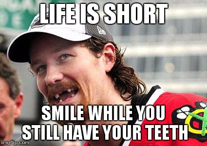 LIFE IS SHORT SMILE WHILE YOU STILL HAVE YOUR TEETH | image tagged in hockey | made w/ Imgflip meme maker