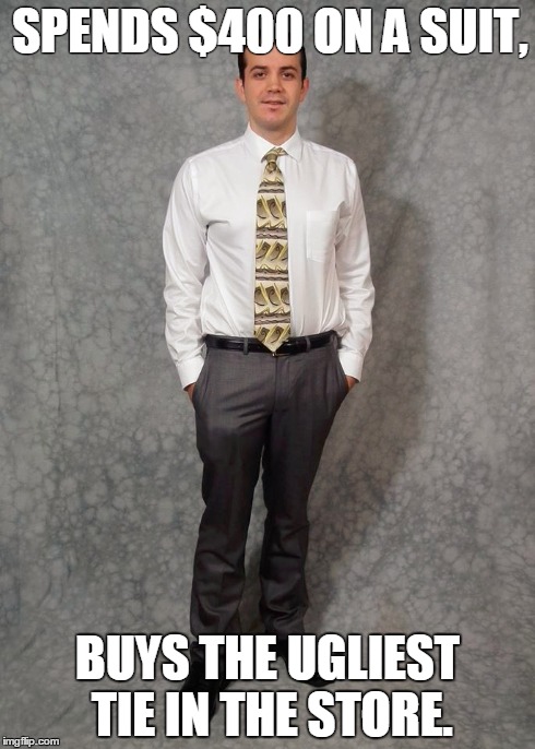Corporate Weenie | SPENDS $400 ON A SUIT, BUYS THE UGLIEST TIE IN THE STORE. | image tagged in corporations | made w/ Imgflip meme maker