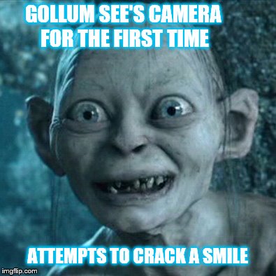 Gollum | GOLLUM SEE'S CAMERA FOR THE FIRST TIME ATTEMPTS TO CRACK A SMILE | image tagged in memes,gollum | made w/ Imgflip meme maker