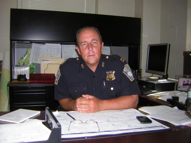 concerned cop at desk Blank Meme Template