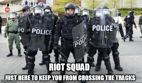 Police | RIOT SQUAD JUST HERE TO KEEP YOU FROM CROSSING THE TRACKS | image tagged in officer,riot | made w/ Imgflip meme maker