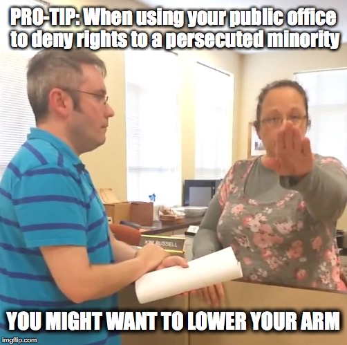 You Might Want to Lower Your Arm | PRO-TIP: When using your public office to deny rights to a persecuted minority YOU MIGHT WANT TO LOWER YOUR ARM | image tagged in kim davis nazi salute,kentucky,kim davis,marriage equality | made w/ Imgflip meme maker