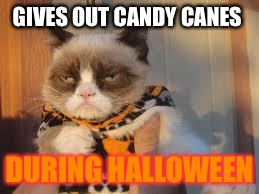 Grumpy Cat Halloween | GIVES OUT CANDY CANES DURING HALLOWEEN | image tagged in memes,grumpy cat halloween,grumpy cat | made w/ Imgflip meme maker