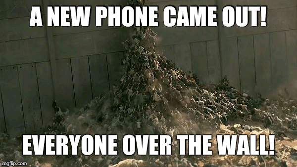 World War Z Meme | A NEW PHONE CAME OUT! EVERYONE OVER THE WALL! | image tagged in world war z meme | made w/ Imgflip meme maker