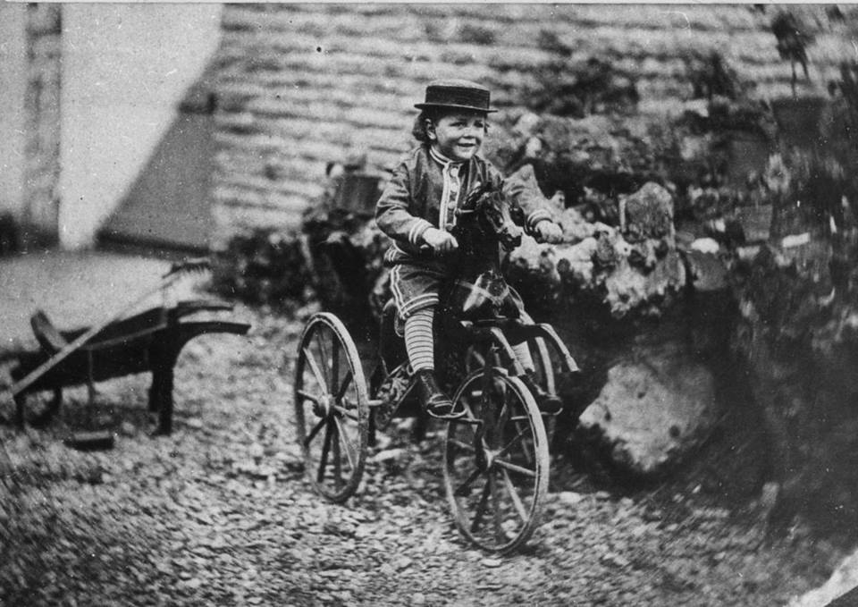 boy rides his horse bicycle around 1870 Blank Meme Template