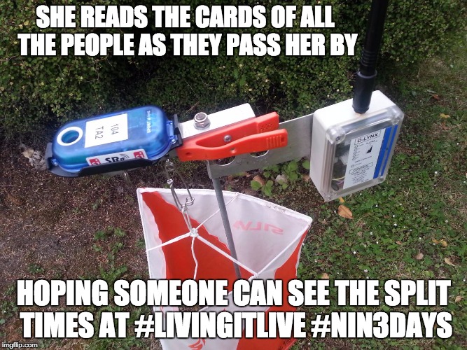 SHE READS THE CARDS OF ALL THE PEOPLE AS THEY PASS HER BY; HOPING SOMEONE CAN SEE THE SPLIT TIMES AT #LIVINGITLIVE #NIN3DAYS | image tagged in orienteering | made w/ Imgflip meme maker