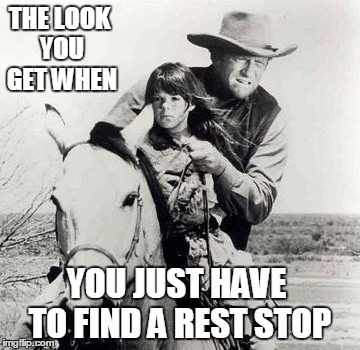 Where's a rest stop when you need one?  | THE LOOK YOU GET WHEN; YOU JUST HAVE TO FIND A REST STOP | image tagged in cowboys,country  western,driving,restroom sign | made w/ Imgflip meme maker